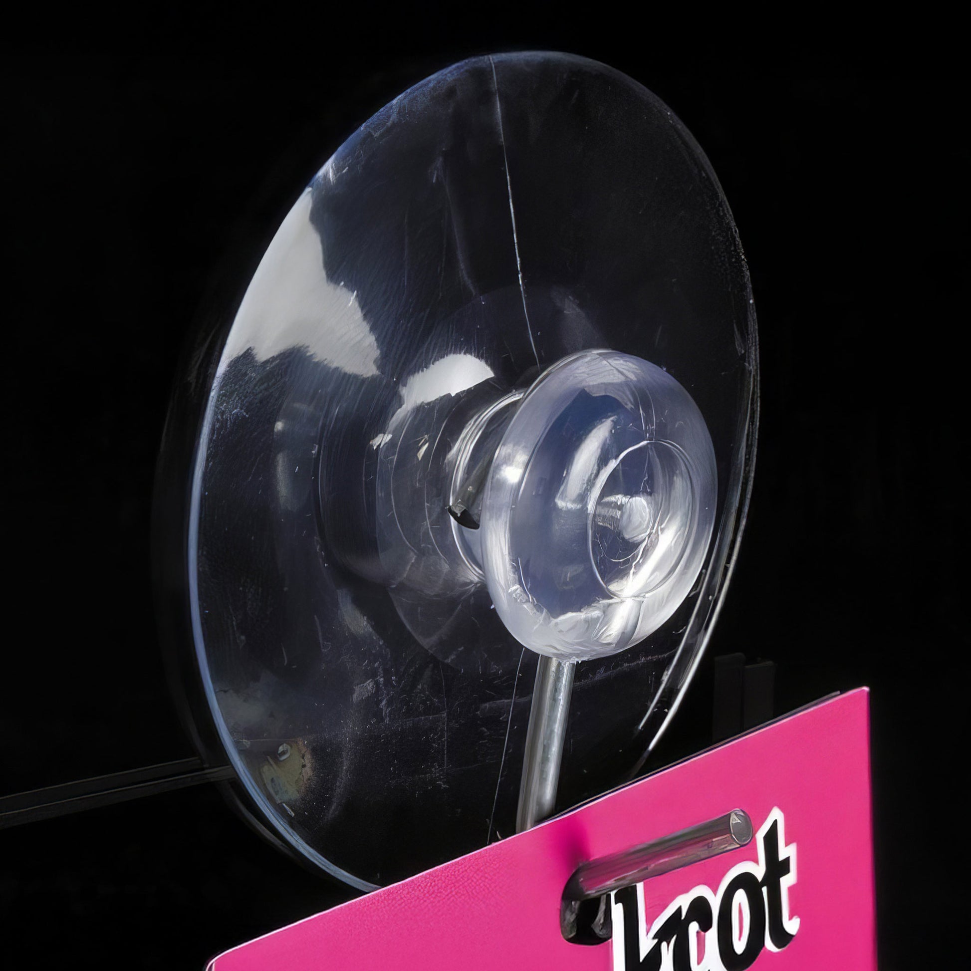 Suction cup with hook to display foam board with drilled holes in window