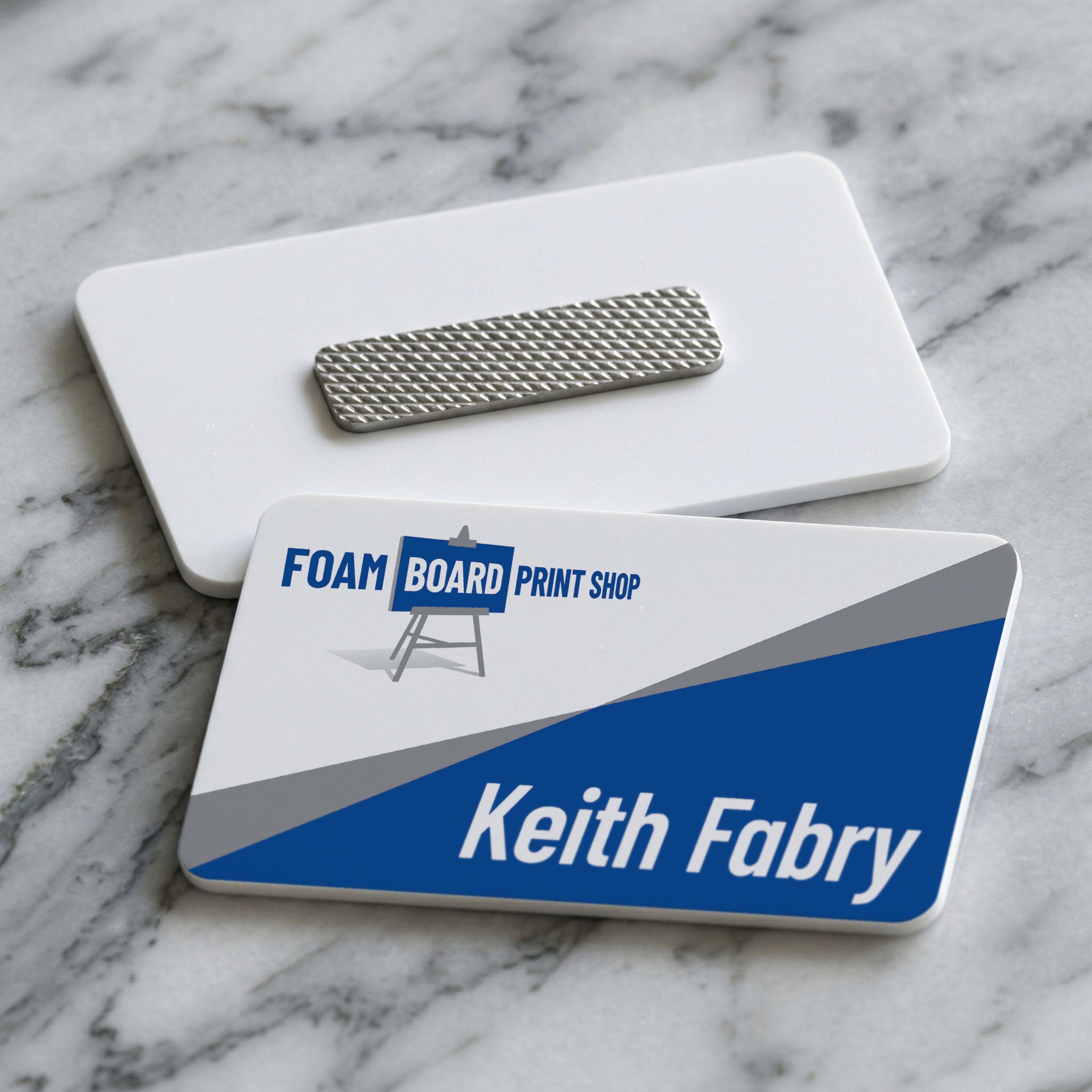 Custom printed name tags with magnetic backers for easy installation and reuse
